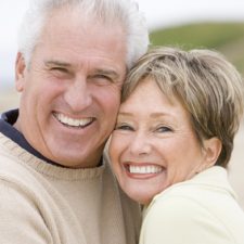 Couple at the beach smiling Couple at the beach smiling